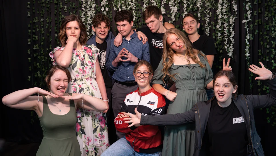 RevGen youth sharing a playful church family photograph